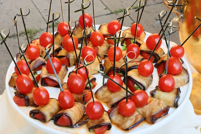 Cherry tomato, mozzarella and basil skewers drizzled with balsamic