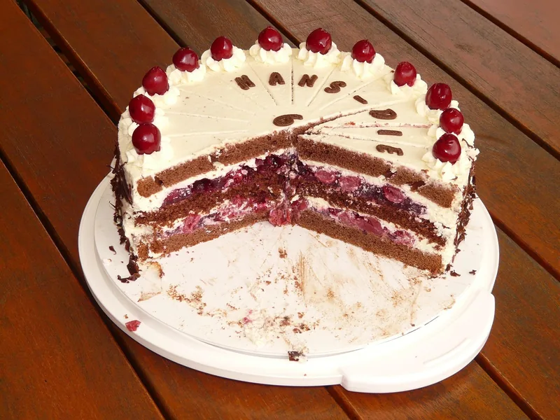 A Black Forest cake with slices cut away