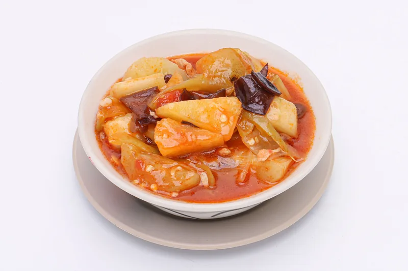 Sweet and sour chicken with pineapple in a bowl