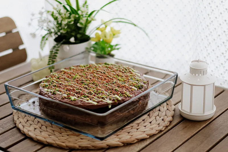A chocolate sheet cake in a glass baking dish