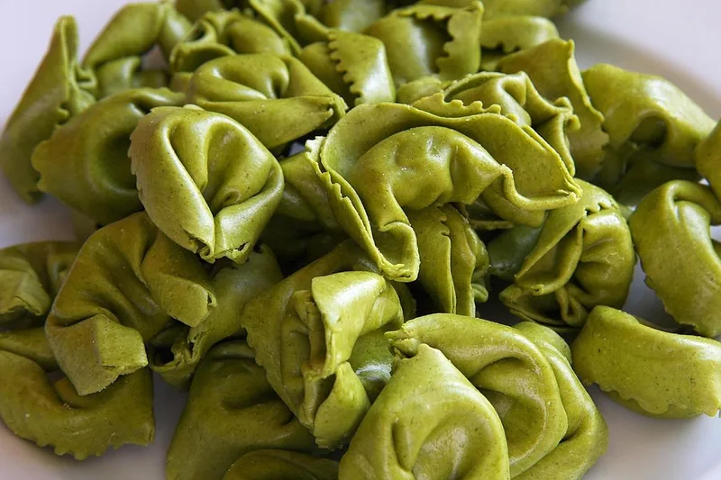 Green spinach tortellini before cooking
