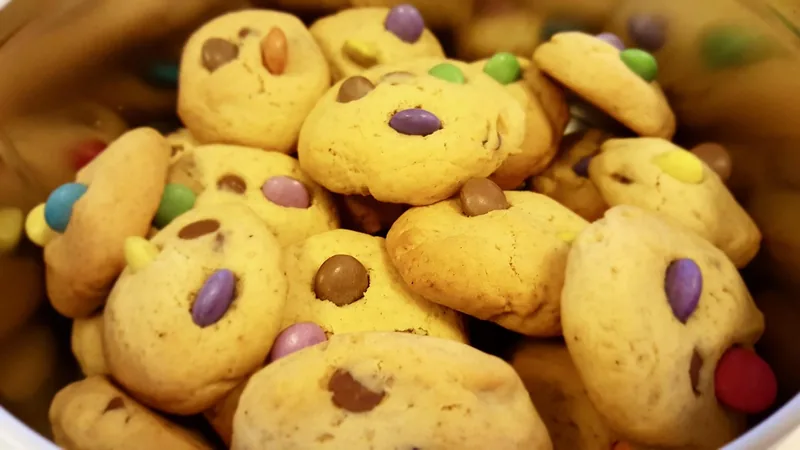 Pale cookies studded with brightly coloured candy-shelled chocolate pieces