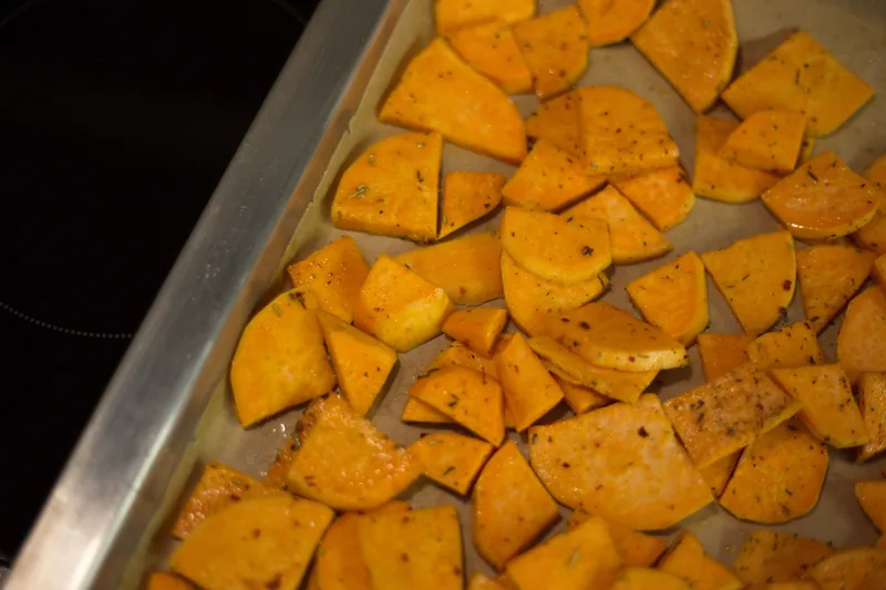 Sweet potato slices on a roasting tray
