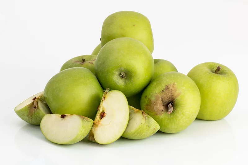 Green apples, one cut open