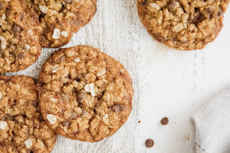 Oatmeal cookies studded with chocolate chips, oats visible in the crumb