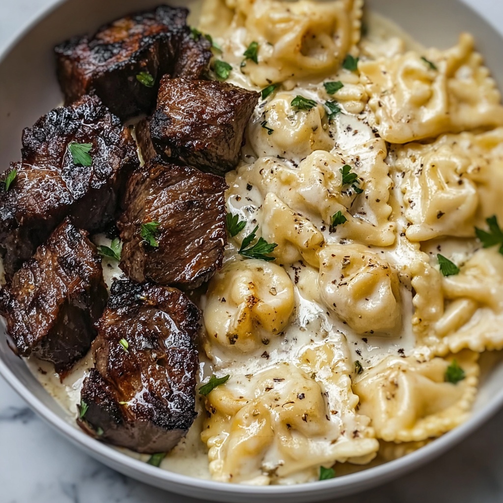 Garlic Butter Steak Bites with Creamy Alfredo Tortellini Recipe - Recipe Image